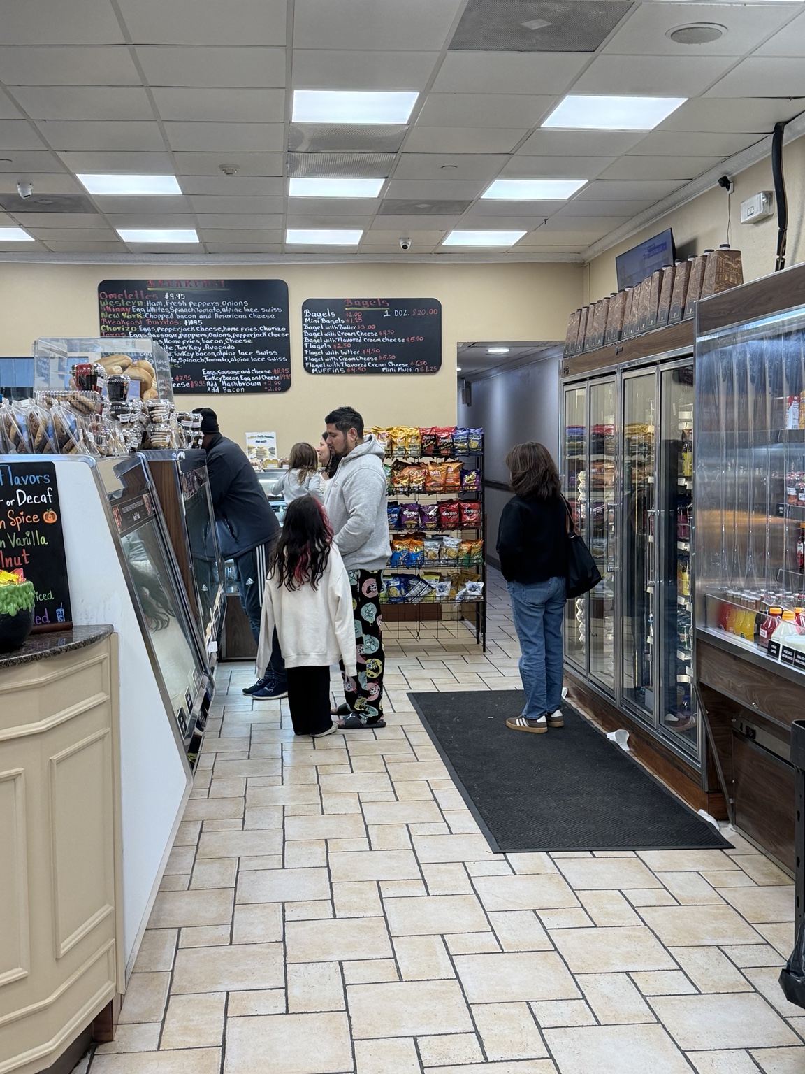 Customers at the Bagel Central deli and bagel counter